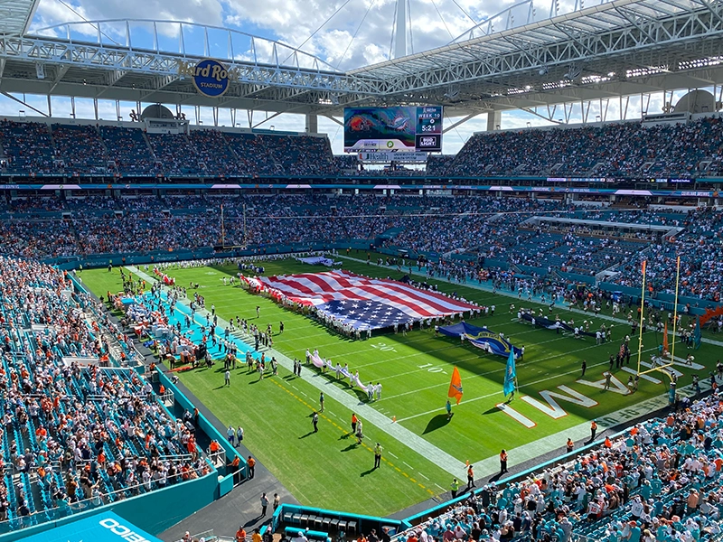 Photograph of a stadium where the United States flag is visible.