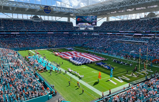 Photograph of a stadium where the United States flag is visible.