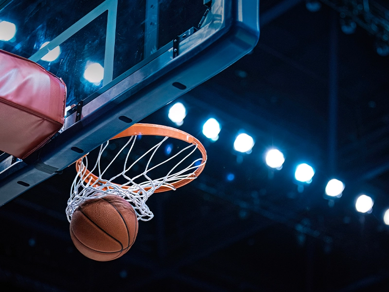 Close-up of a basketball going into the basket
