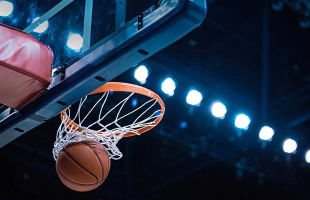 Close-up of a basketball going into the basket