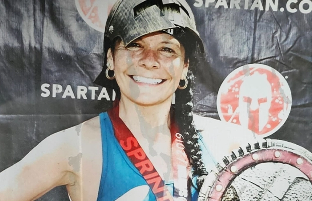 photo of woman with medal in championship