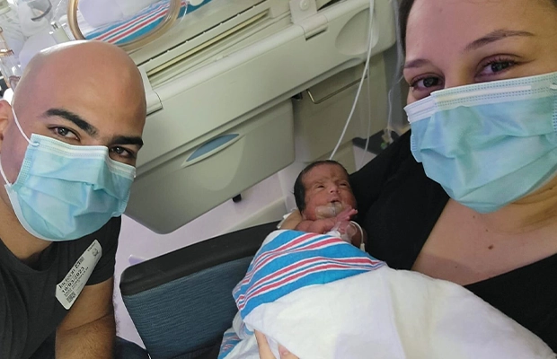 couple selfie with their baby