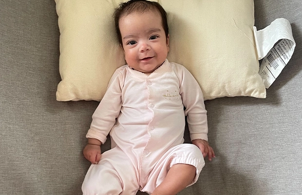 baby smiling at the camera