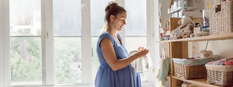 A woman getting a baby room together