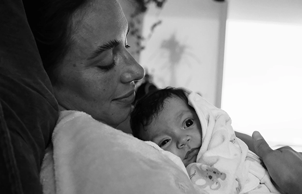 black and white photo of mother with her baby