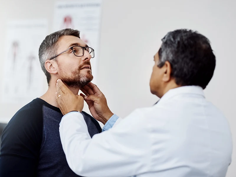 man being examined by a doctor