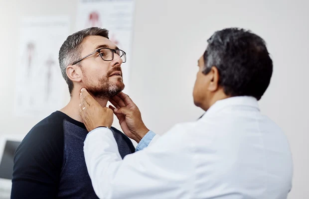 man being examined by a doctor