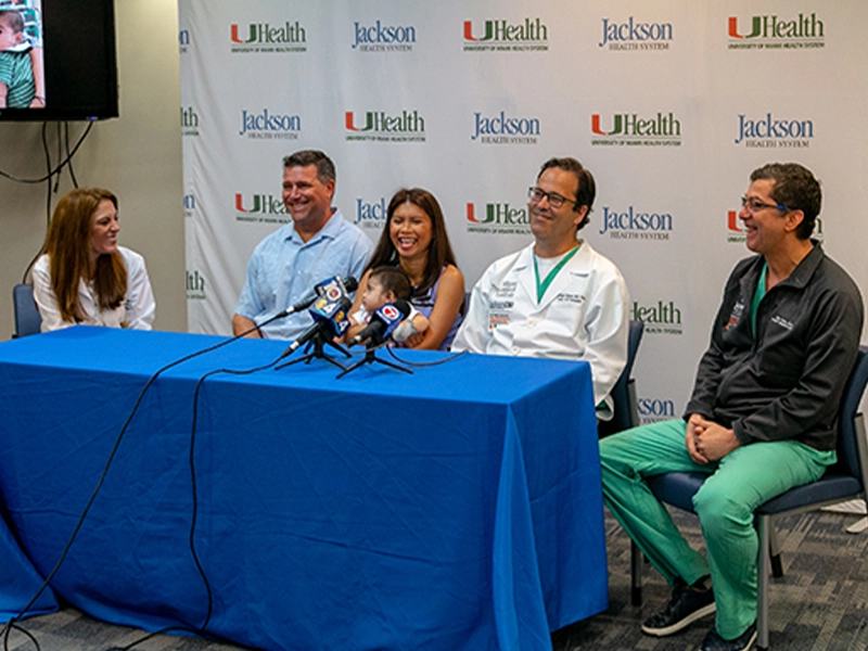 Michael David Antonio Angelo with his mother, father, and his multidisciplinary team at a press conference