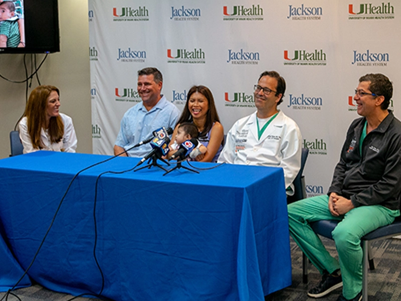 Michael David Antonio Angelo with his mother, father, and his multidisciplinary team at a press conference