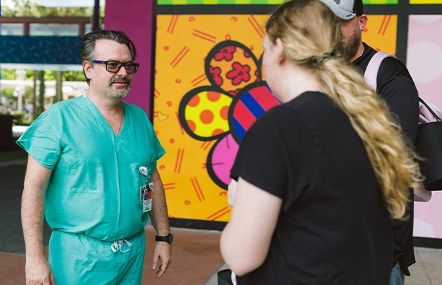 a woman talking to a doctor