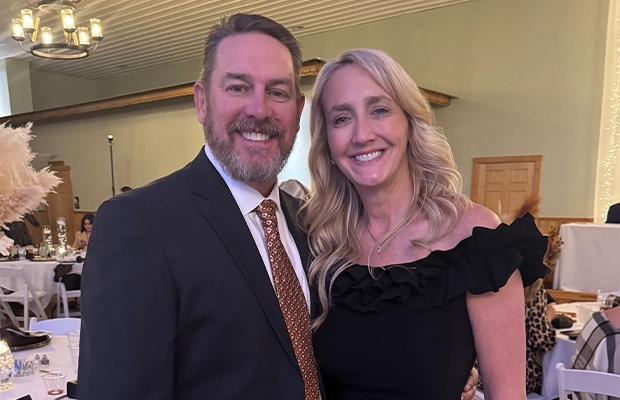 Photograph of a couple dressed in formal attire during an event