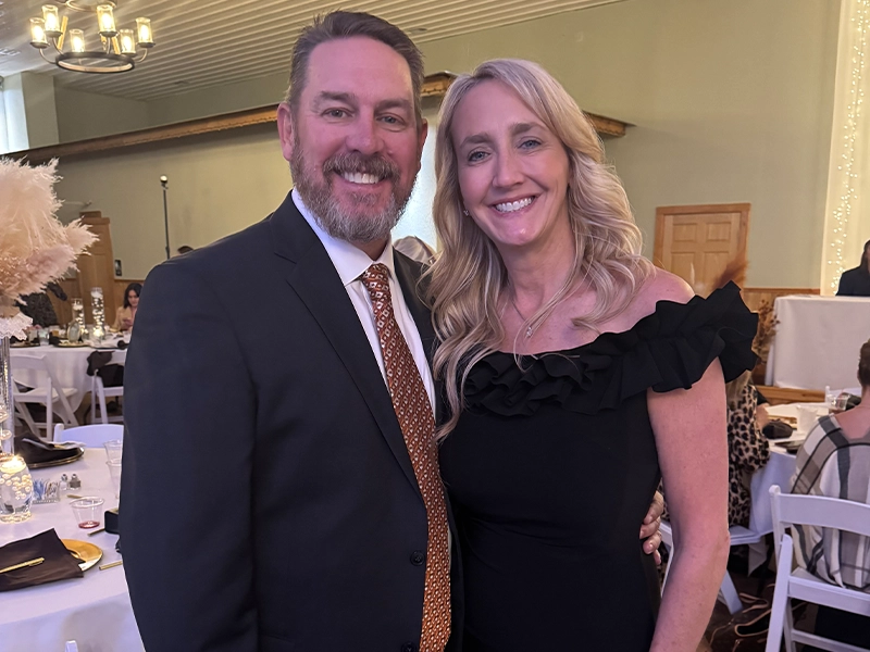 Photograph of a couple dressed in formal attire during an event