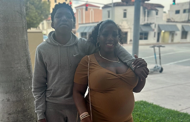 woman posing with her son