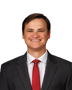 Close-up of a man wearing a suit.