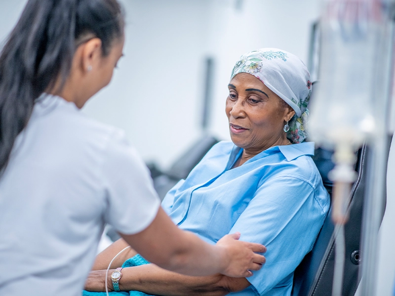 female doctor checking female patient