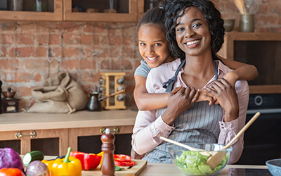 mom and daughter cooking