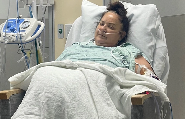 woman lying on a hospital stretcher