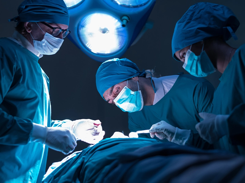 Photo of a group of doctors performing surgery