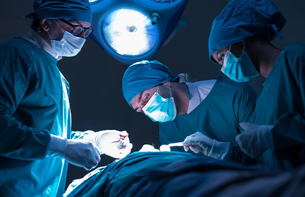 Photo of a group of doctors performing surgery