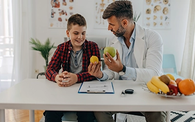 Doctor showing food to child