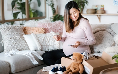 pregnant woman opening box