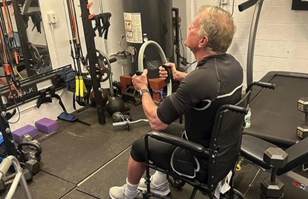 A person in a wheelchair in a gym