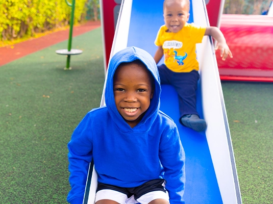 Children playing on the slide