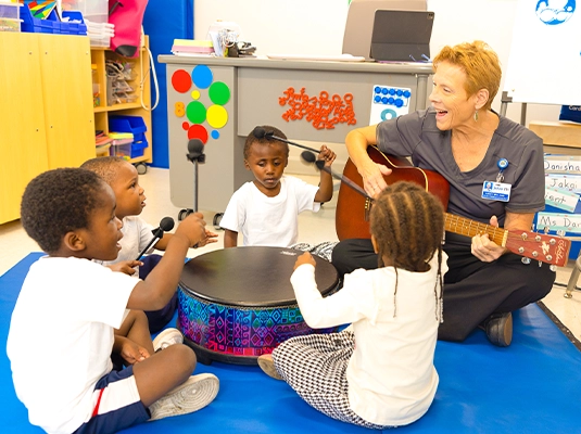 Children playing instruments in their music class