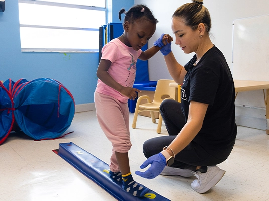 Girl doing therapy with nurse