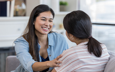 woman conversing with girl