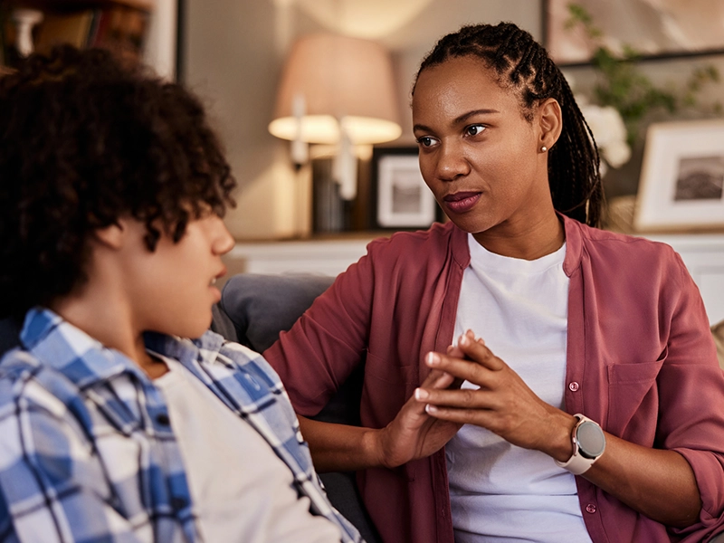 image of a woman talking to her son