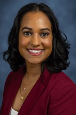 A headshot of a woman smiling