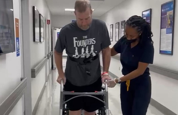 man doing therapy next to nurse