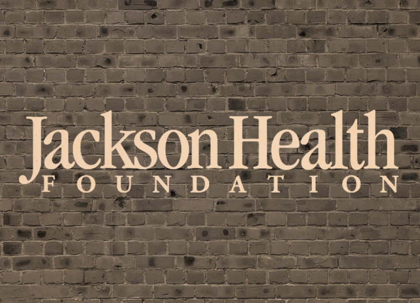 Jackson Health Foundation logo over a brick wall