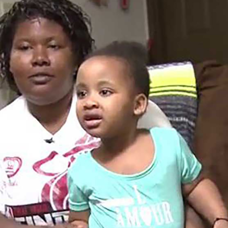 Tiffany Davis sitting down with her young daughter, Skyla Milton