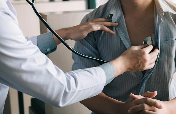 Close-up of a man being examined by a doctor