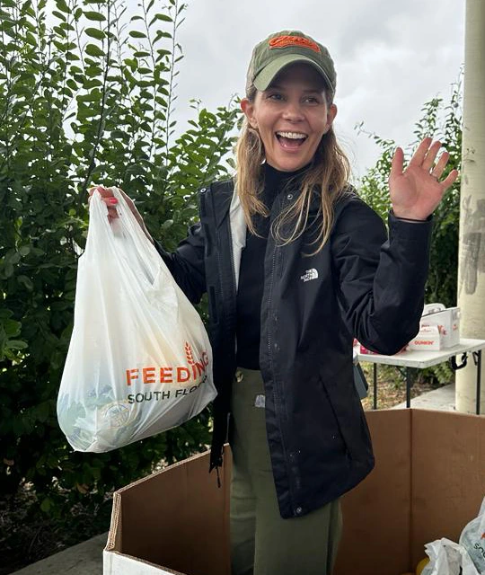 woman carrying plastic bag