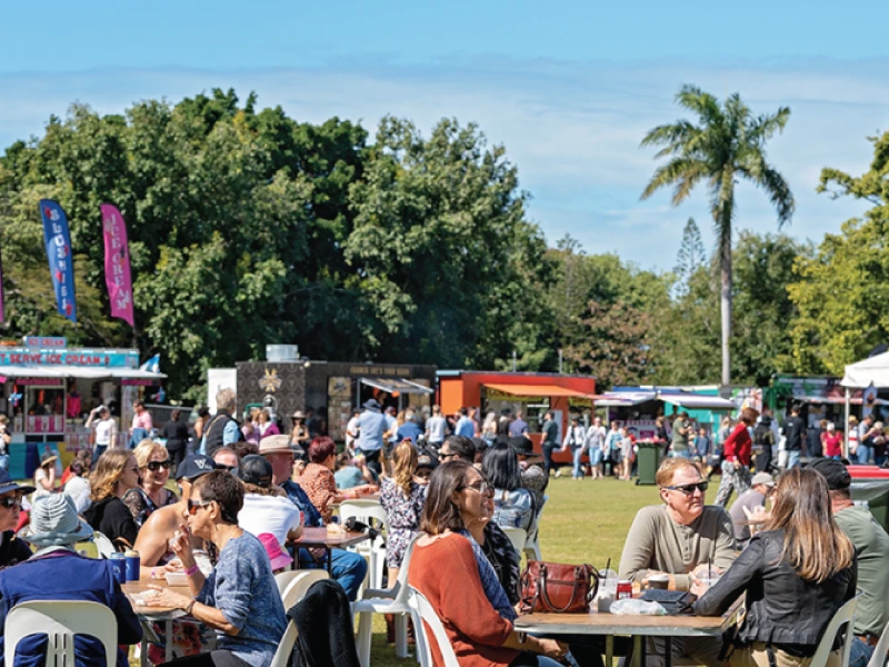 group of people gathered in a park during an event