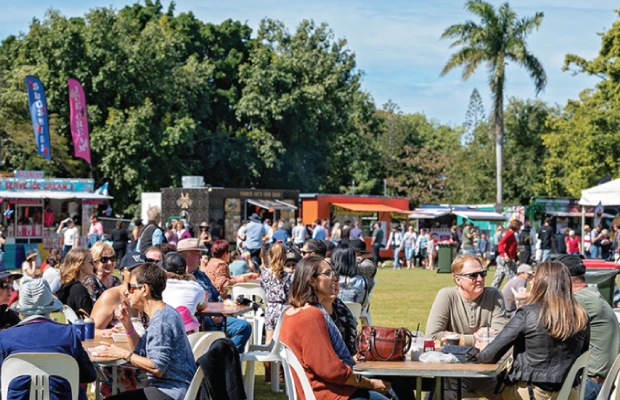group of people gathered in a park during an event