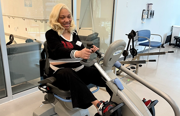 Woman exercising on a gym machine