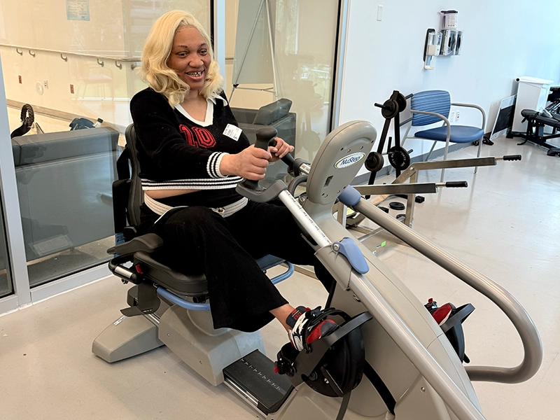 Woman exercising on a gym machine