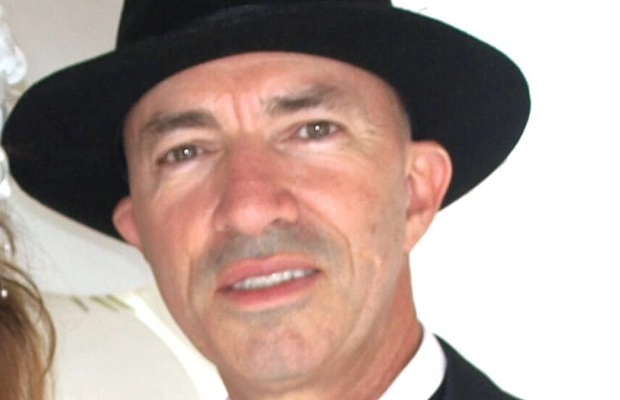 closeup of man wearing hat
