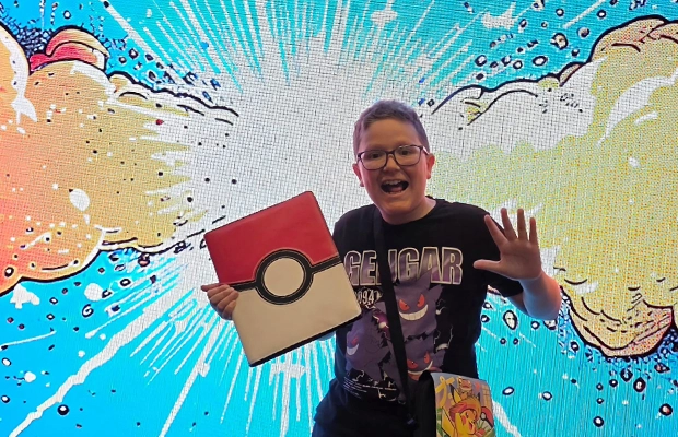 smiling boy with a drawn background behind him