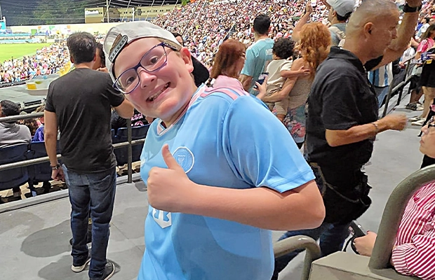 Boy smiling at a sporting event