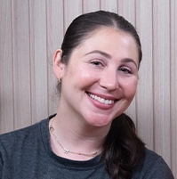 Close-up of a woman smiling at the camera.