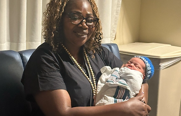 woman carrying a small baby