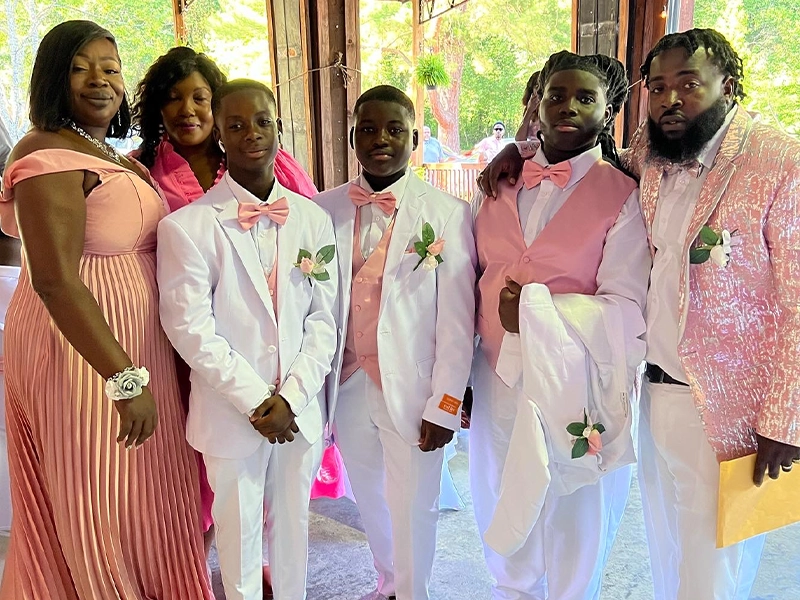 family dressed in formal attire during a formal event