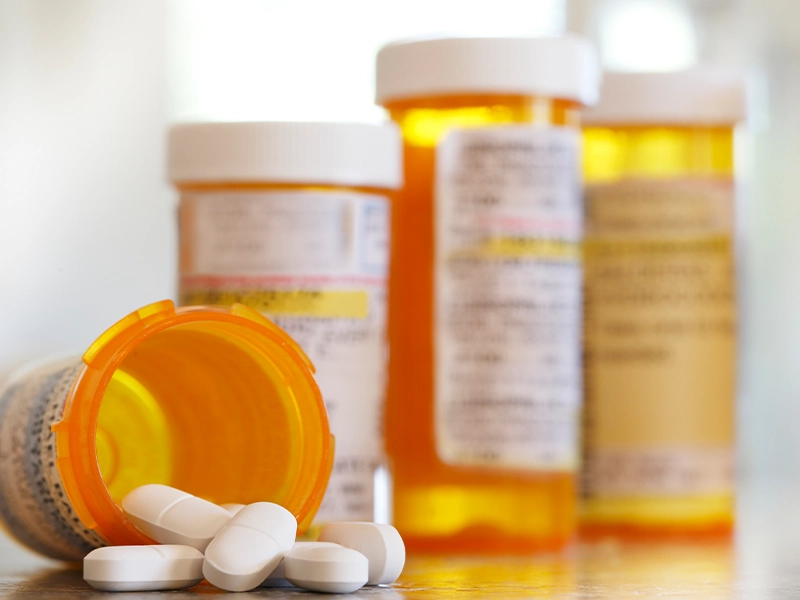 Photograph of an orange medicine bottle.