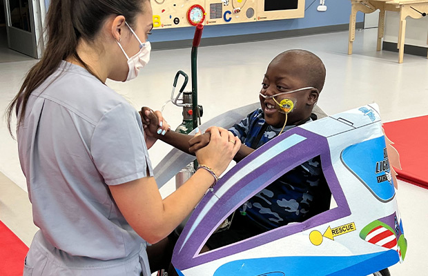 Boy doing therapy with a nurse