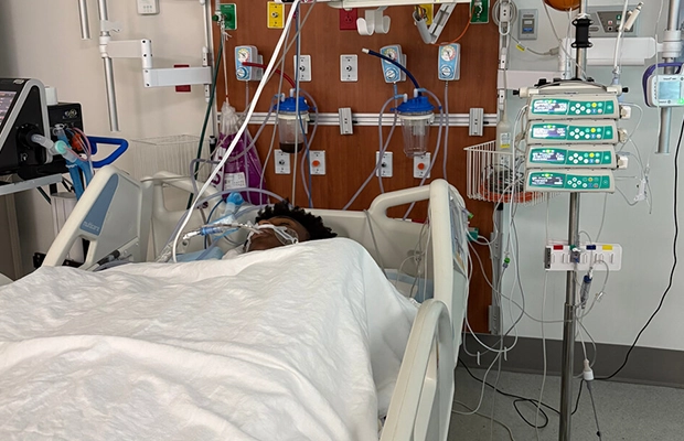 Young man intubated on a hospital stretcher